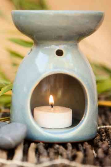 ceramic candle oil warmer with lit tealight