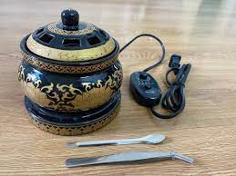 black electric incense burner with cord and tongs