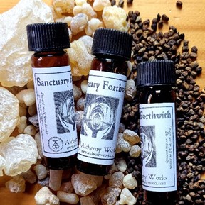 Sanctuary Forthwith Oil Bottles on a bed of Copal, Frankincense and Cardamom